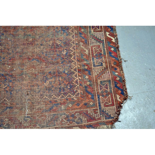 5 - An antique carpet of some age