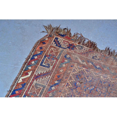 5 - An antique carpet of some age