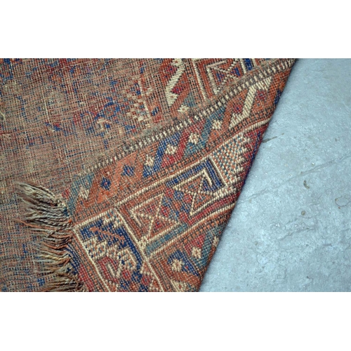 5 - An antique carpet of some age