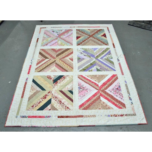 7 - A good quality patchwork quilt - signed and dated by the maker