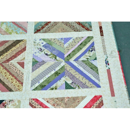 7 - A good quality patchwork quilt - signed and dated by the maker