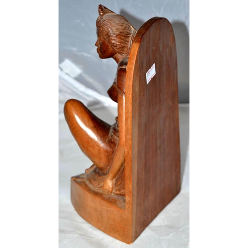 699 - A vintage carved wooden figure of a Asian woman