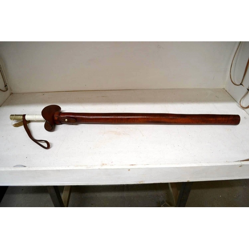 710 - An unusual vintage mounted police baton in leather sheath - likely Metropolitan Police