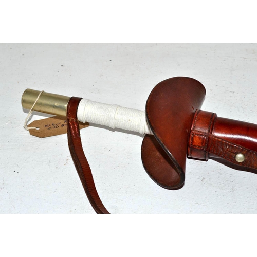 710 - An unusual vintage mounted police baton in leather sheath - likely Metropolitan Police