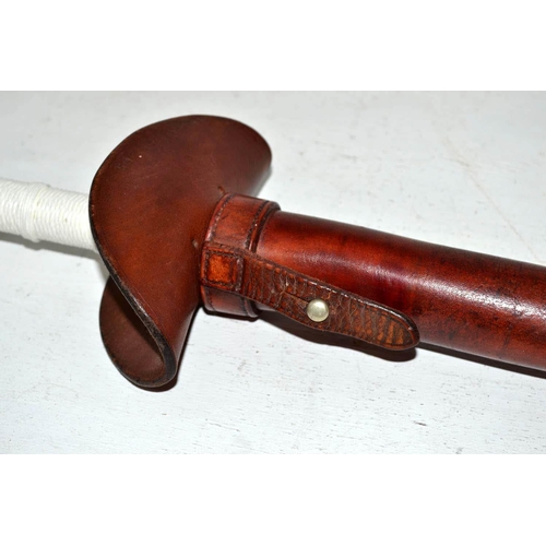 710 - An unusual vintage mounted police baton in leather sheath - likely Metropolitan Police