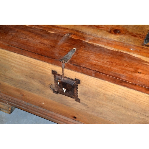 111 - A large hardwood coffee table trunk with iron fittings