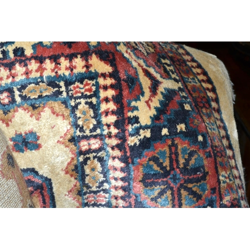 117 - A large cream ground rug decorated with birds etc