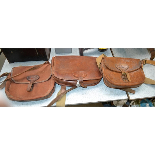 384 - 3 leather cartridge bags and a gun slip