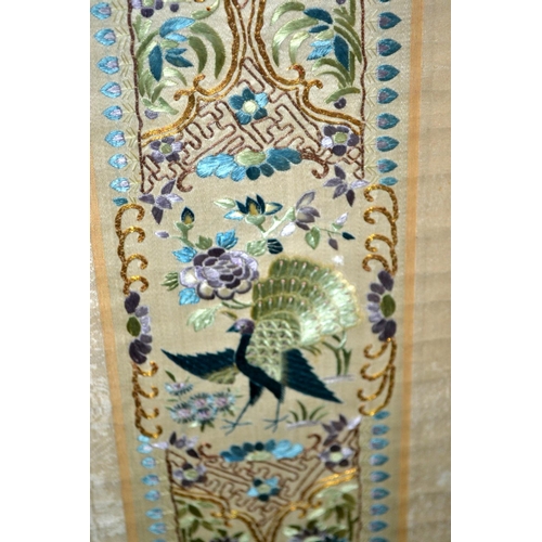 222 - A vintage oriental silkwork panel depicting a Peacock - probably Chinese