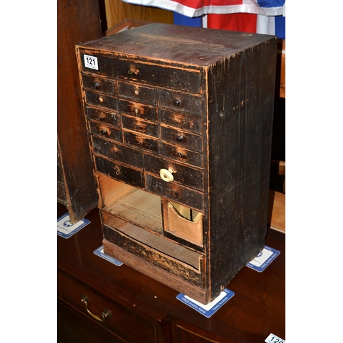 121 - A vintage wooden multi-drawer cabinet