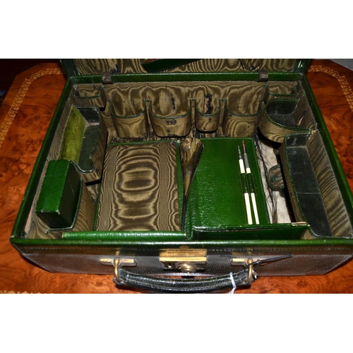 164 - An antique green Moroccan leather Mappin & Webb travelling case with some contents