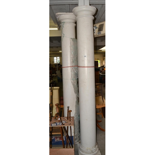 239 - A large pair of composition Doric columns - approx 9 feet tall