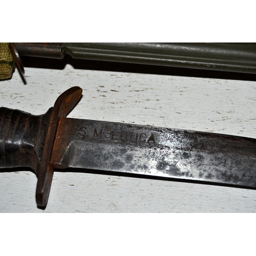 554 - A WW2 period US M3 Utica fighting knife in a US M8A1 scabbard