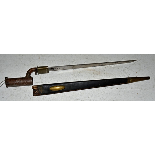 568 - An antique socket bayonet and scabbard with unusual locking mechanism