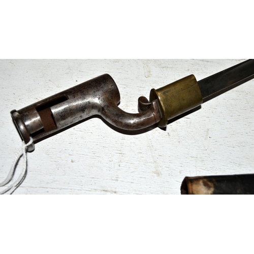 568 - An antique socket bayonet and scabbard with unusual locking mechanism