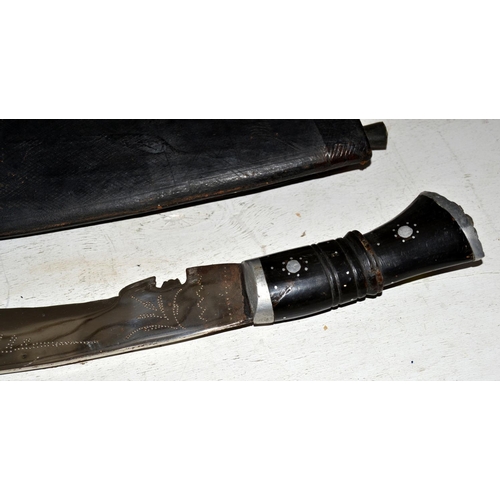 573 - An unusually large Kukri knife and scabbard