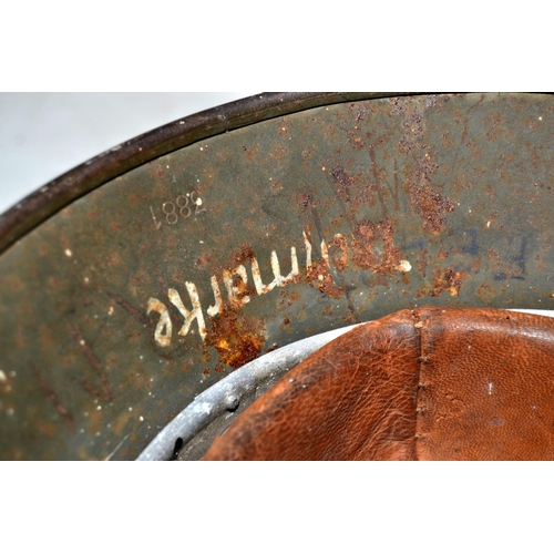 591 - A WW2 German Double Decal helmet with original 1938 ink stamp on liner