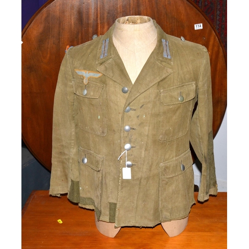 597 - A WW2 period German Prisoner of War Afrika Korps tunic - with original eagle later added for display