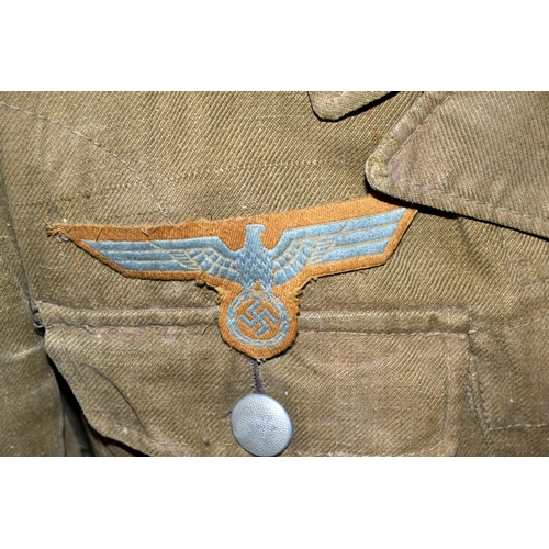 597 - A WW2 period German Prisoner of War Afrika Korps tunic - with original eagle later added for display