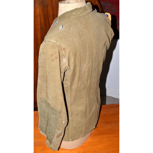 597 - A WW2 period German Prisoner of War Afrika Korps tunic - with original eagle later added for display