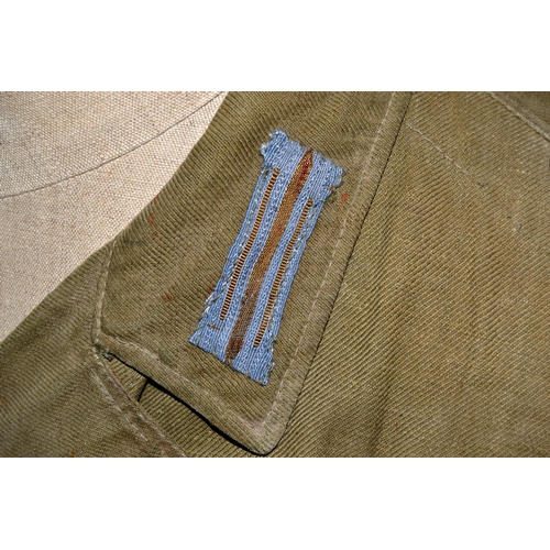 597 - A WW2 period German Prisoner of War Afrika Korps tunic - with original eagle later added for display