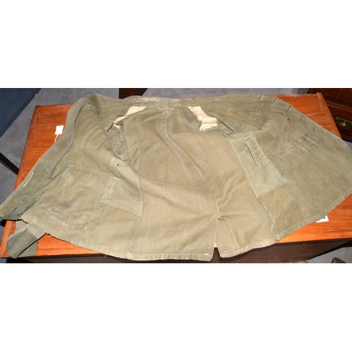 597 - A WW2 period German Prisoner of War Afrika Korps tunic - with original eagle later added for display