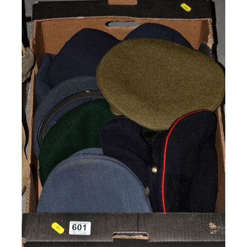 601 - A box of military caps etc