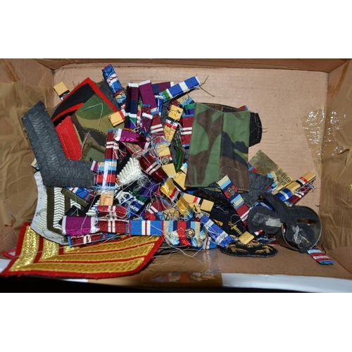 605 - A qty of medal bars and ribbons, military badges and patches etc