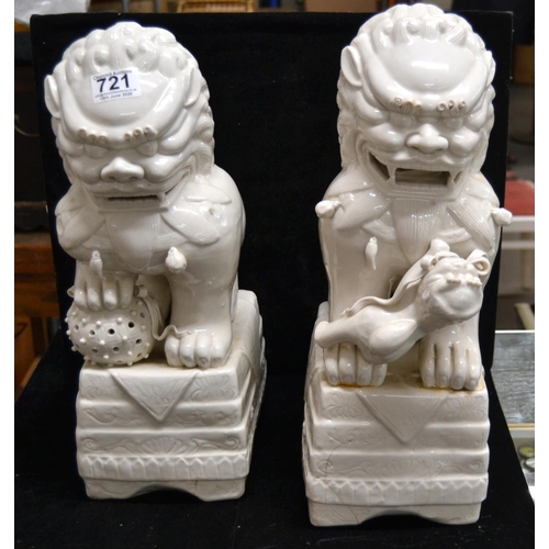 721 - A pair of large Chinese Blanc de Chine Dog of Fo or Temple Dog figures