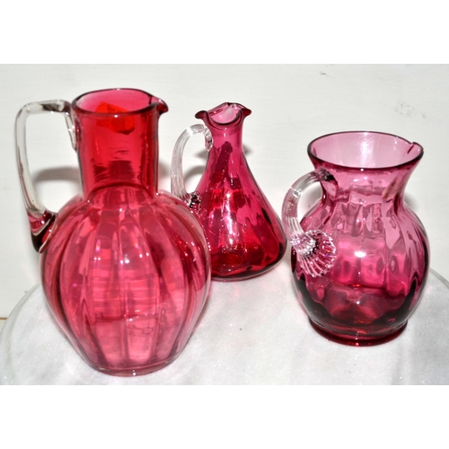 758 - 3 antique cranberry glass jugs