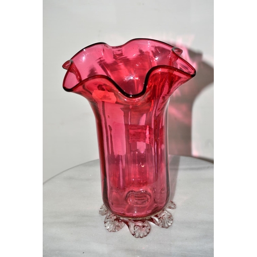 763 - A large antique cranberry glass vase with fluted rim