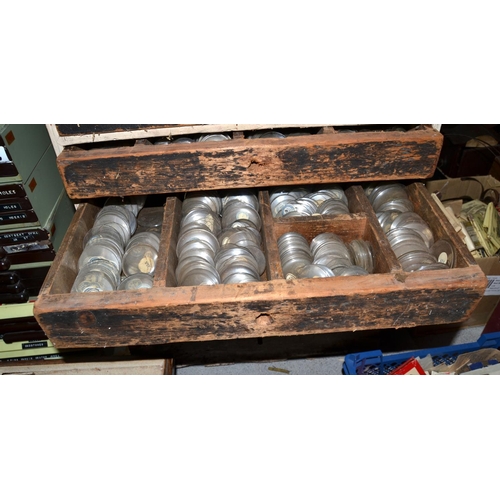 825 - A vintage 8 drawer chest containing 100's of new old stock watch glasses