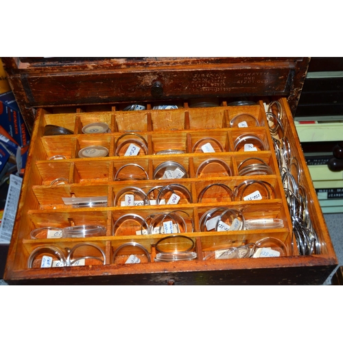 830 - A 6 drawer table top cabinet containing tools and watch glasses