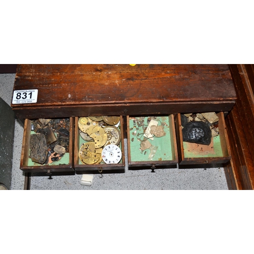 831 - A small vintage table top cabinet containing watch parts etc