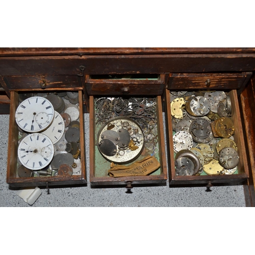 831 - A small vintage table top cabinet containing watch parts etc