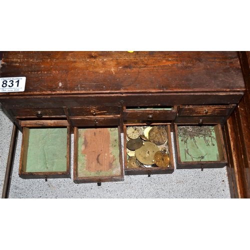 831 - A small vintage table top cabinet containing watch parts etc