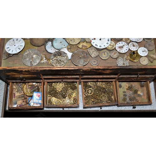 832 - A small vintage table top cabinet containing watch parts etc