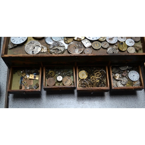 832 - A small vintage table top cabinet containing watch parts etc