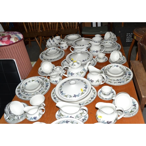 975 - An extensive Royal Doulton burgundy pattern dinner service