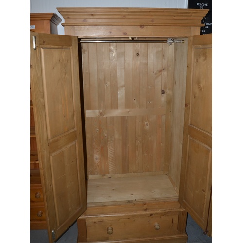 170c - A large modern pine wardrobe