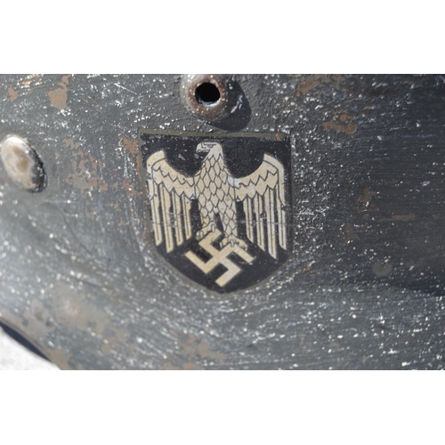 591 - A WW2 German Double Decal helmet with original 1938 ink stamp on liner