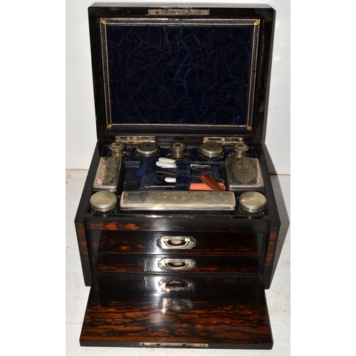 5 - A Victorian Coromandel fitted vanity box with silver plated fittings.