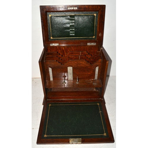 25 - A vintage oak stationary box with leather interior