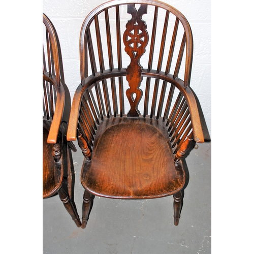 131a - A pair of antique Elm seated wheel back country armchairs