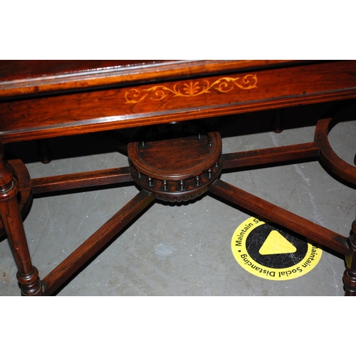 134 - An unusual inlaid Mahogany table with gallery base