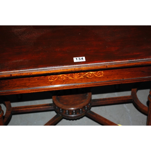 134 - An unusual inlaid Mahogany table with gallery base