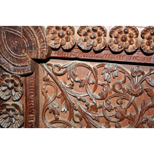 223 - An antique Anglo Indian carved wooden fire screen