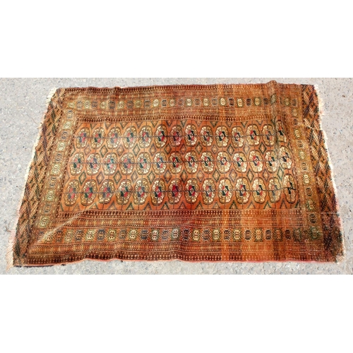 32 - An unusual brown flatweave rug