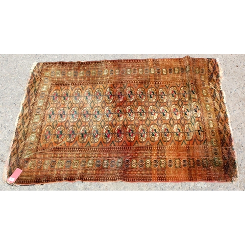 32 - An unusual brown flatweave rug