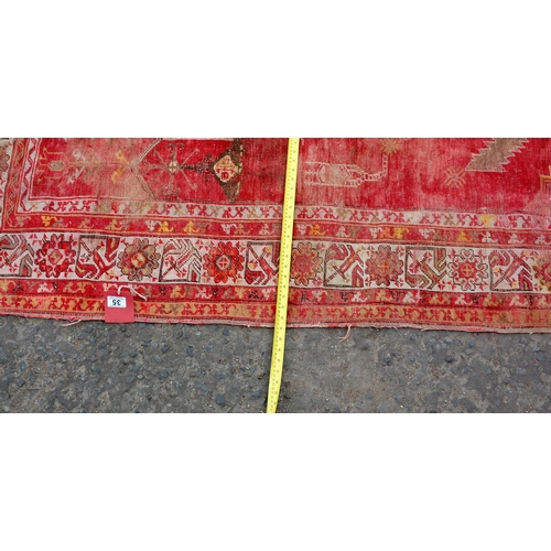 35 - A vintage red ground Prayer rug of larger size